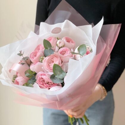 Elegant ranunculus and eucalyptus bouquet with soft, layered petals and fresh greenery. A delicate, seasonal floral arrangement with delivery in Prague.