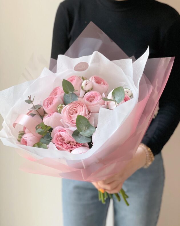 Elegant ranunculus and eucalyptus bouquet with soft, layered petals and fresh greenery. A delicate, seasonal floral arrangement with delivery in Prague.